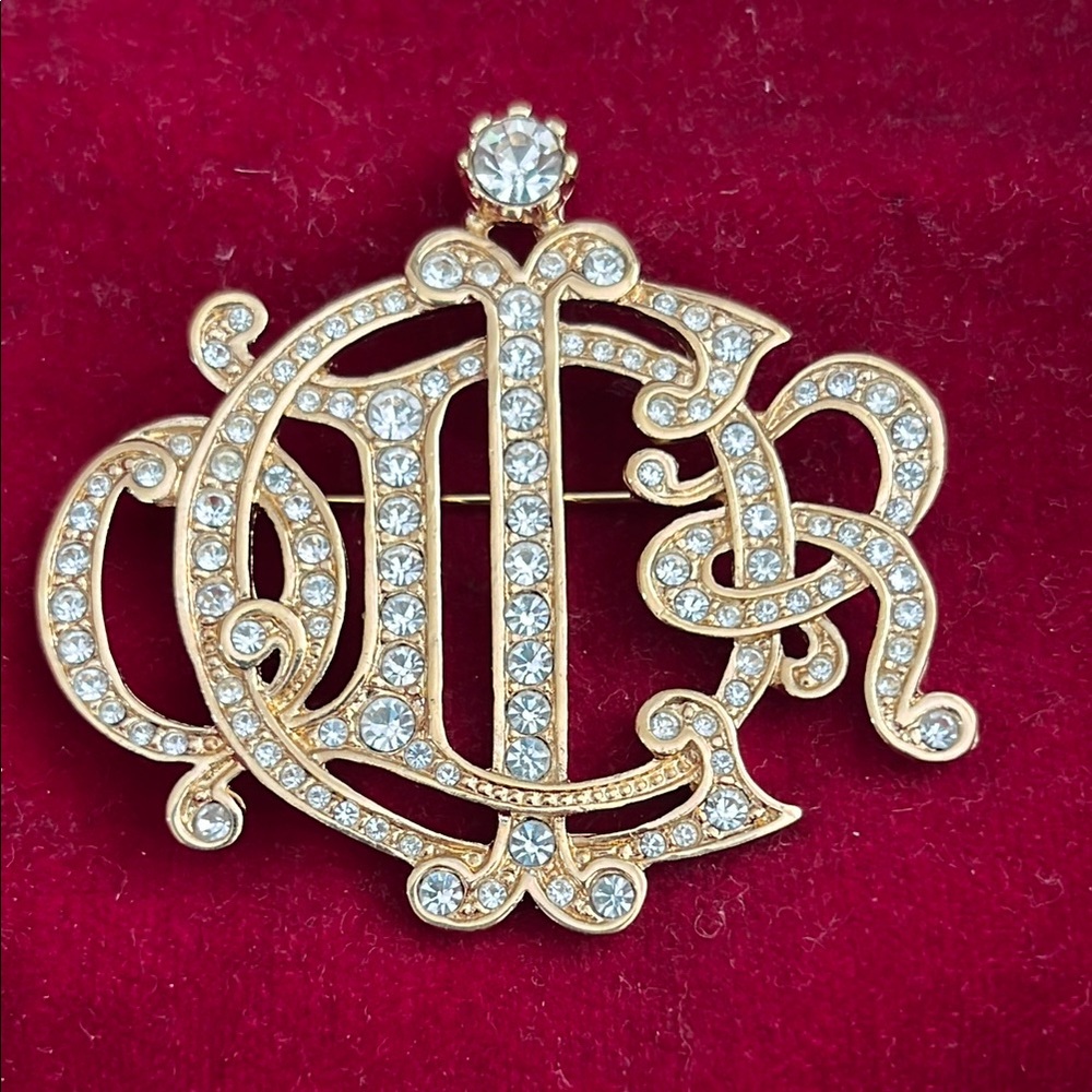 Christian Dior signature brooch